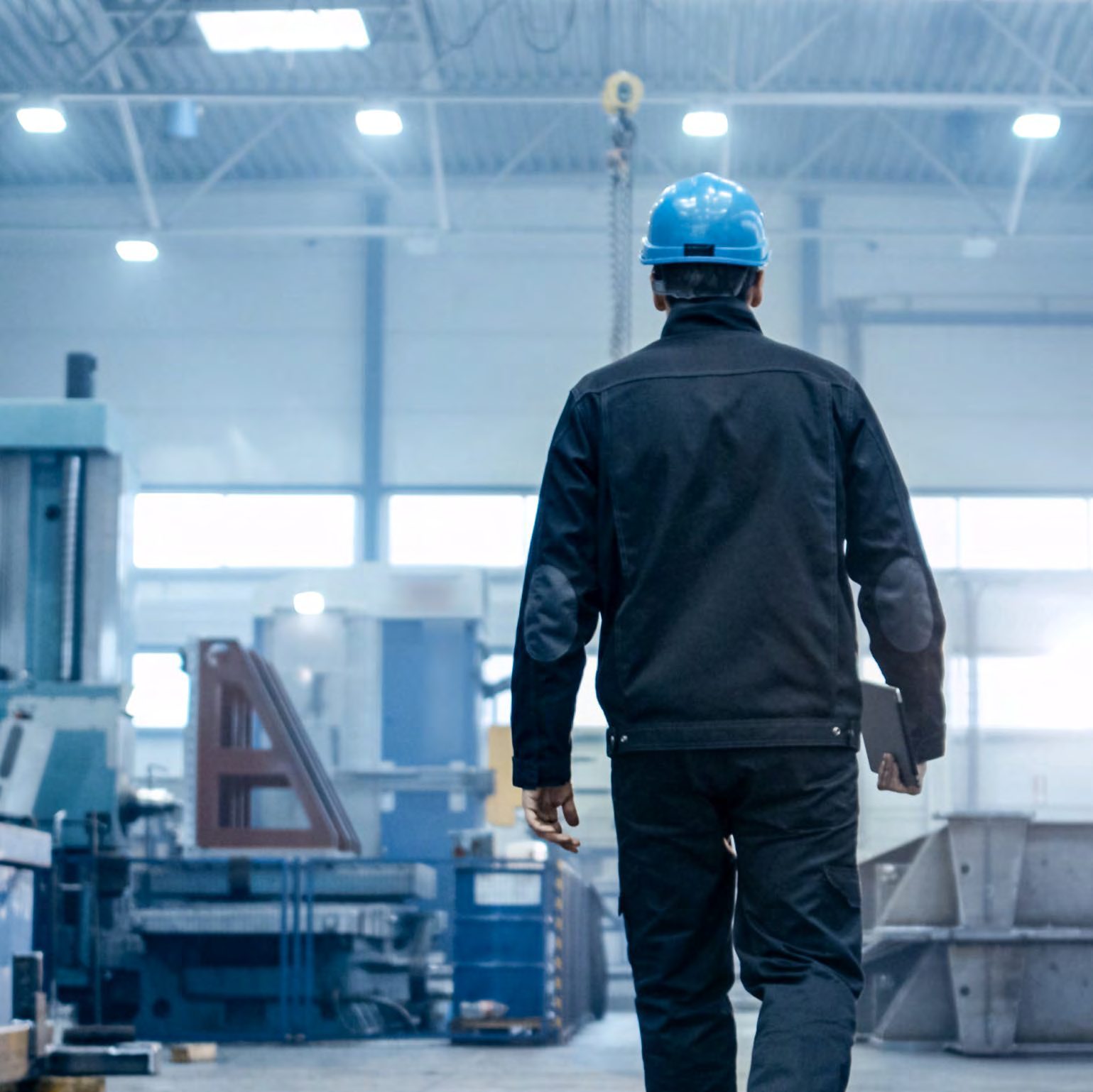 APSL warehouse floor with team member in safety helmet